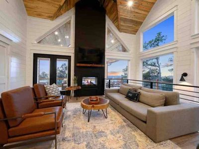 The living room has a couch and additional seating around a fireplace!