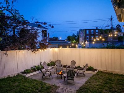 Unwind at night on the bluestone patio, perfect for bonfires under the lights in the heart of Kingston