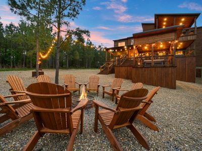 The fire pit with Adirondack chairs surrounding!