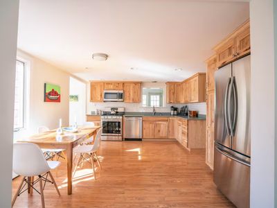 Kitchen and dining area filled with natural sunlight