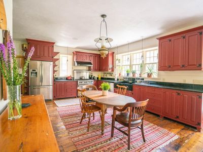 Chef's kitchen with eat in dining and stocked well stocked with cooking supplies.