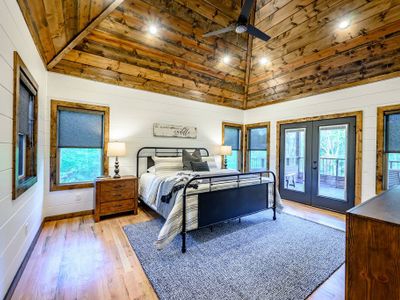 An upstairs King Suite has access to a private balcony overlooking the creek.