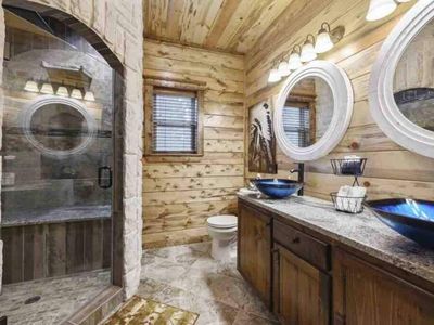 Master Bathroom 1. Double sink and a sone walk-in shower.