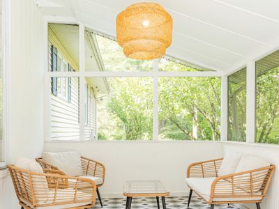 The Three Seasons Room, located just off the dining and kitchen area, opens onto the back deck and in-ground pool. It’s the perfect space to gather and socialize with friends and family.