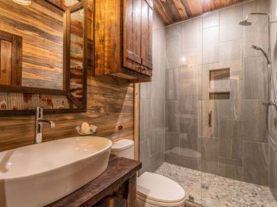 Full bathroom with a walk-in shower.