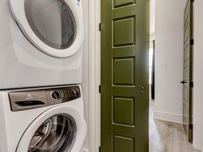 Convenient laundry room before our favorite bathroom and upstairs master bedroom!