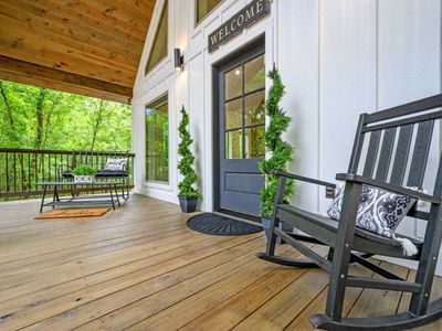 Rocking chairs on the front porch invite you in!