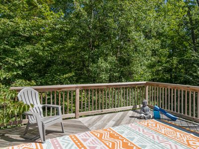 This peaceful space is located just off the primary bedroom, perfect for slow mornings surrounded by the trees.