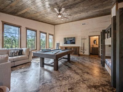 Pool table and oversized sectional.