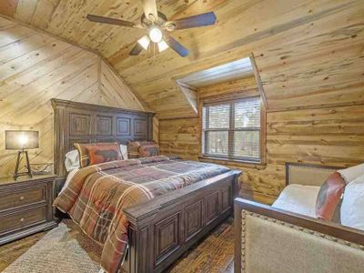 Upstairs Master Suite 5, has a day bed with trundle to accommodate more guests.