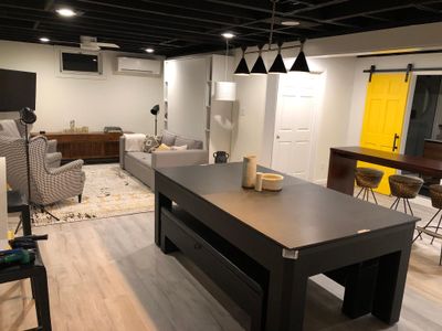 Newly renovated downstairs has a pool table that also doubles as a ping pong table.