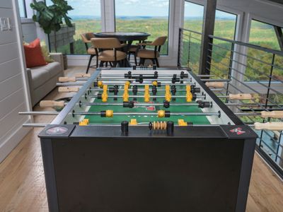 Foosball table & seating area with coffee table and stunning views.