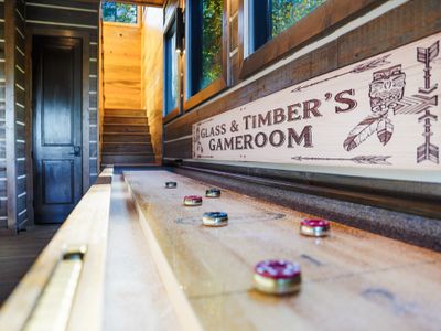 Just off the kitchen, Glass and Timber has an expansive game room with something for everyone, wrapped in warm rustic charm.