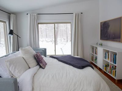 Winter photos of the library area with pull-out Queen bed.