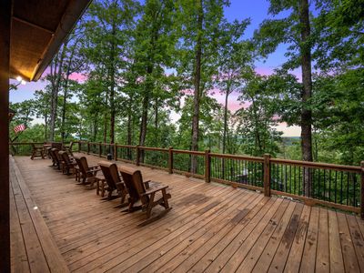 Rocking chairs and side tables on the patio.