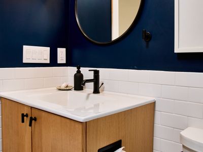 This full bath is off the upstairs hallway in the main house, shared by the two guest bedrooms.
