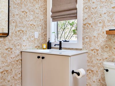 This half bath is on the first floor of the main house, just off the music room.