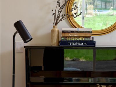The upright piano in the music room.