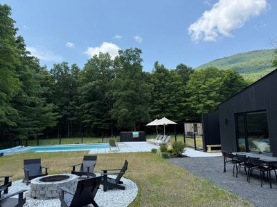 Gather poolside around the fire pit, with sweeping mountain and forest views all around.