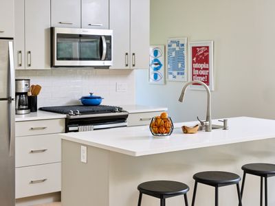 The guest house kitchen, with island and stool seating.