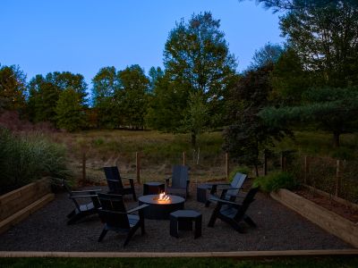 Evenings are exquisite by the propane fire pit, steps from the pool deck.