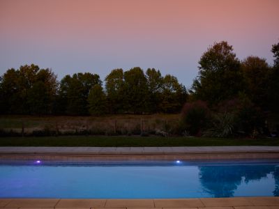 Thoughtful lighting invites guests to enjoy swimming into the evening.