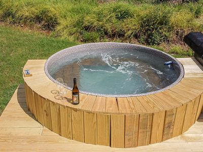 Soak away your worries in the hot tub surrounded by nature