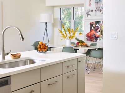 As you enter the guest house, you'll find the property's second full kitchen to your right, with dining area beyond.