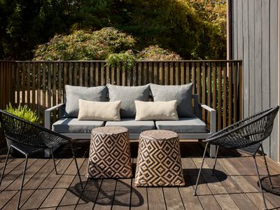 Loungers on the main house deck, accessed through the oversized sliding doors.