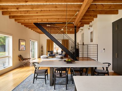 The main house dining area and central stairs, looking towards the music room.