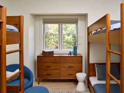 The second bedroom in the guest house features two bunk beds, perfect for kids.