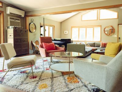 Bright, sunny open concept living room area with piano - only for experienced players