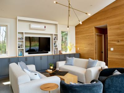 Looking into the pool house living room, with entry to another full bathroom just beyond.