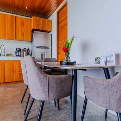 A comfortable dining setup with modern amenities and thoughtful details for guests.