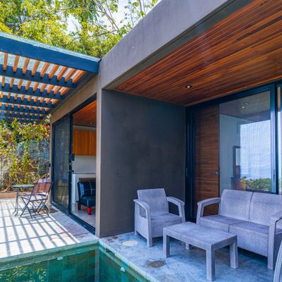 Covered terrace with outdoor seating and easy access to the villa.