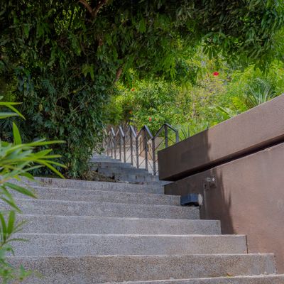 A private entry staircase leads you through lush greenery to your peaceful retreat.