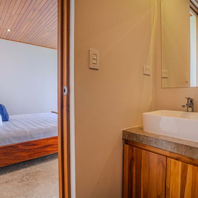 A clean and modern ensuite bathroom adds comfort and privacy to the bedroom.