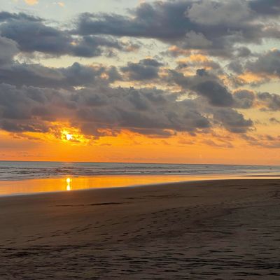 Sunset at playa Palo Seco - steps from your vacation rental