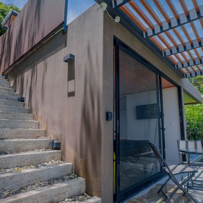 A private stairway entrance leads you into the villa’s serene tropical setting.