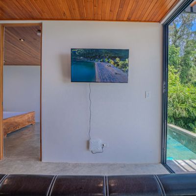 Wall-mounted TV in the living area for relaxing evenings indoors.