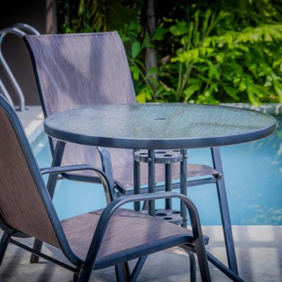 Sip your morning coffee or evening drink beside the private pool.