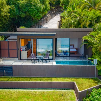 This modern tropical villa offers a private pool and a seamless indoor-outdoor layout.