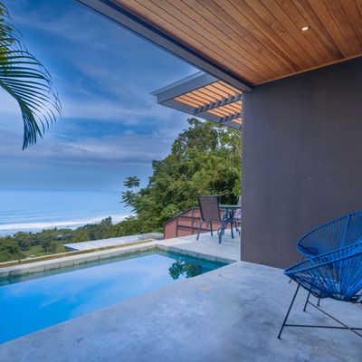 Private infinity pool with ocean views and a relaxing outdoor seating area.