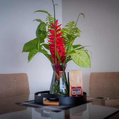 Fresh tropical flowers bring a warm Costa Rican welcome to the space.