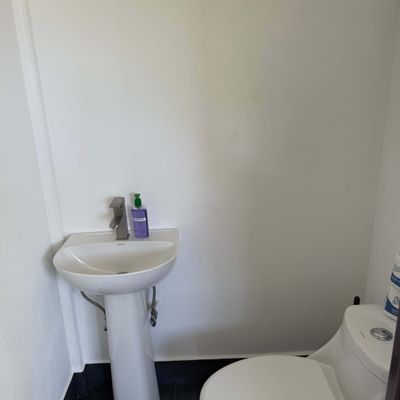 Convenient half bathroom for the pool and bar area so Guests don't have to go inside the home while outside.