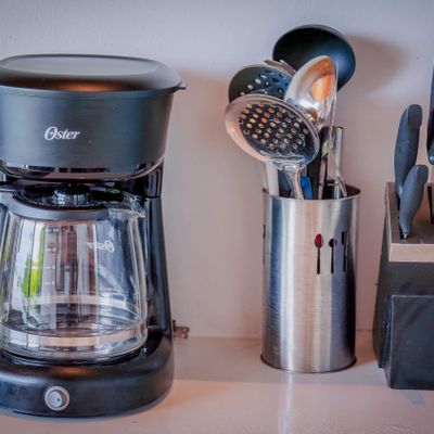 Coffee maker and kitchen essentials provided for a comfortable stay.