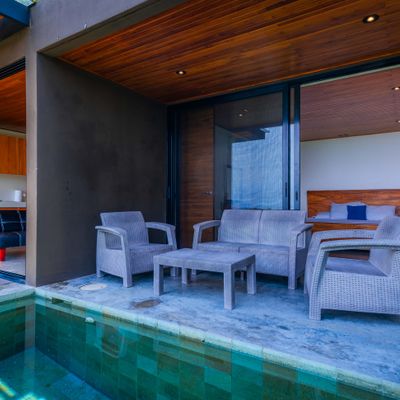 Relax by the pool just steps from the bedroom and covered terrace.