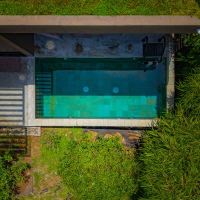 A private pool retreat surrounded by nature, perfect for cooling off after a beach day.