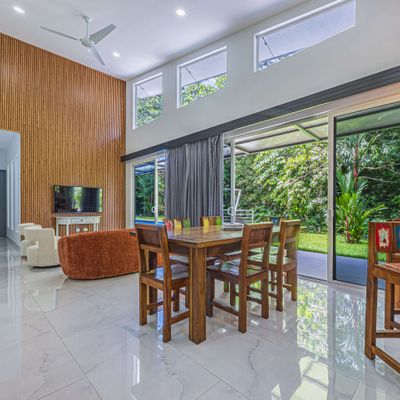 Spacious living area, designed with large windows that frame the pool perfectly.