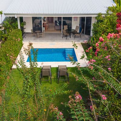 Lush green zone surrounding the villa for peaceful outdoor moments.